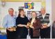 ORG-COBDEN CURLING CLUB members honoured for 50 years. Shawna McBride making the presentation to Don Whillans, Gladys Francis and Jack Gemmill, April 2001