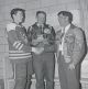 SPORTS-Micksburg winning Hockey team Jack Costello and Russell Leach receive trophy from Joe Robinson